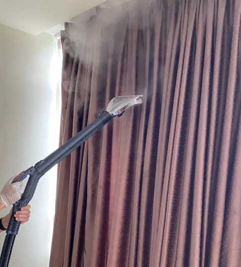Long curtains being steam cleaned in Perth